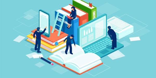 people working on a computer, a book, and a tablet