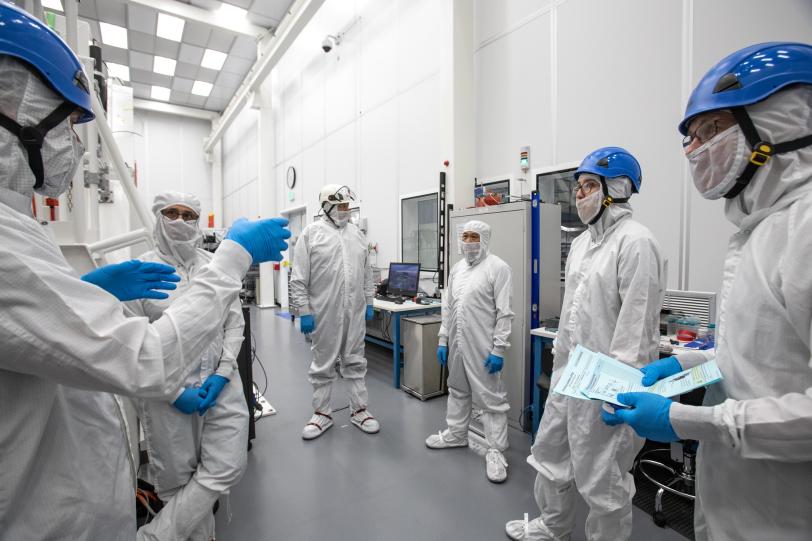 SLAC techs in protective dress.
