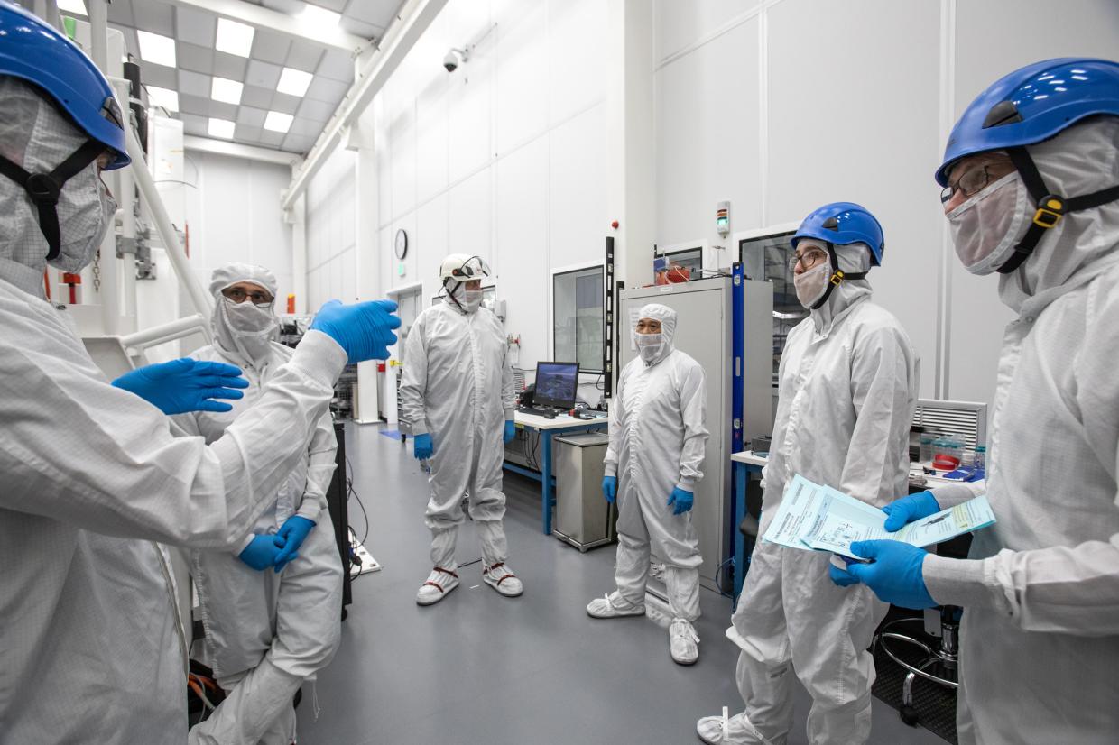 SLAC techs in protective dress.
